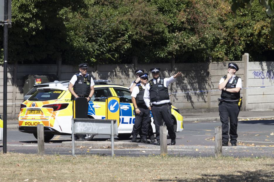 Police officers at a crime scene.