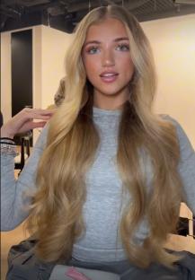Princess Andre showing off her long blonde hair.