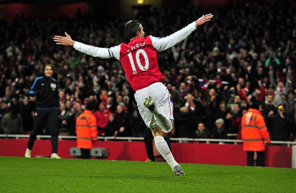 Arsenal striker Robin Van Persie celebrates scoring a goal at Emirates Stadium.
