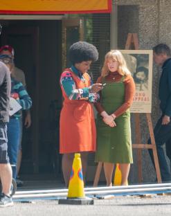 Filming of Call the Midwife Christmas special; two actresses in period costume on set.