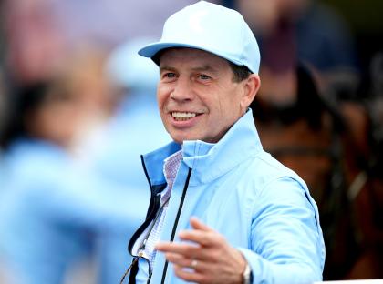 Trainer Jamie Osborne at a horse race.