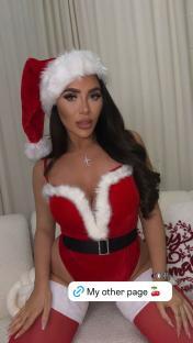 Woman in a Santa outfit.