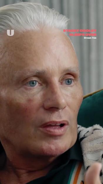 Close-up of a man speaking.