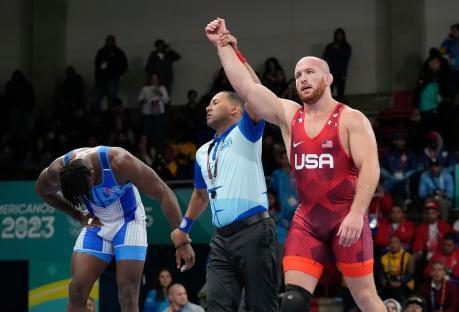 Kyle Snyder of the United States celebrates winning a gold medal in wrestling.