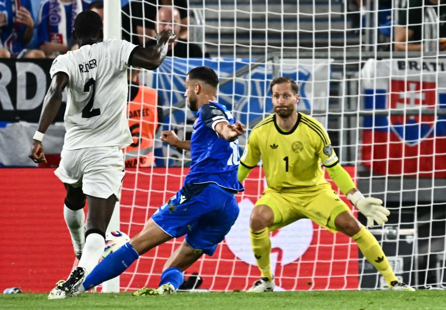 Slovakia's David Hancko scoring a goal against Germany during a World Cup qualifier.