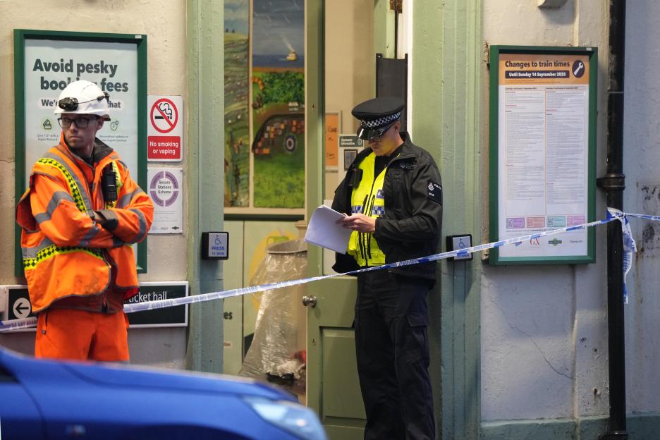 Police officer at Seaford Station investigating a murder.