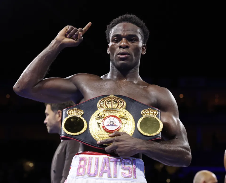 Boxer Joshua Buatsi wearing a championship belt.