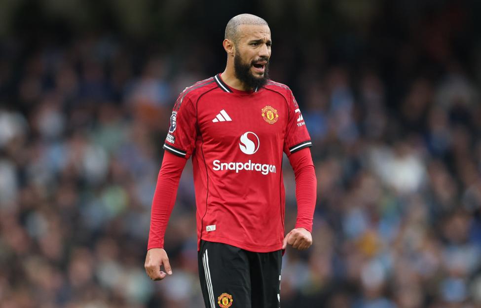 Noussair Mazraoui of Manchester United in a red jersey.