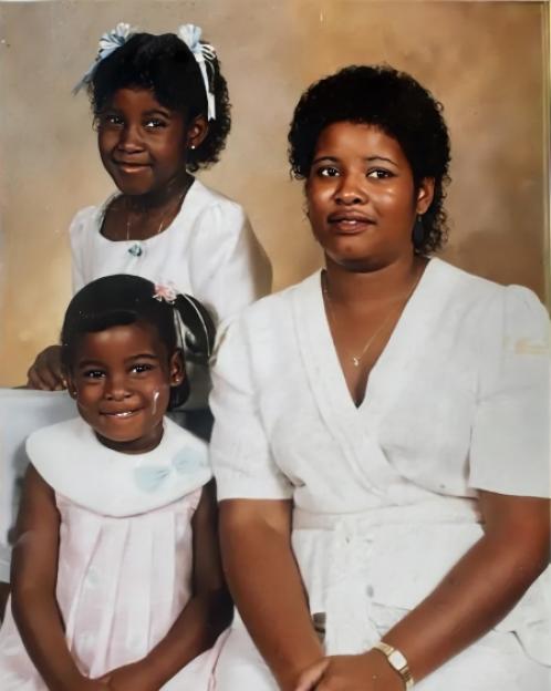 Photo of a woman and two young girls.