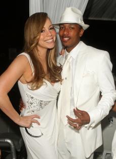 Mariah Carey and Nick Cannon at a white party.