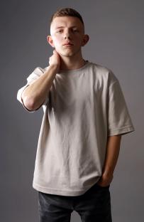 Portrait of Roman Lavrinovich, a 21-year-old Ukrainian man.