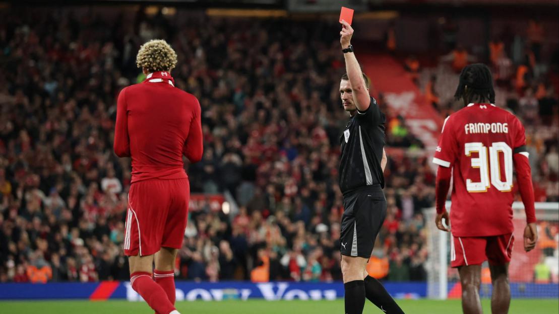 Referee Thomas Bramall shows Liverpool's Hugo Ekitike a red card.