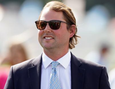 Charlie Fellowes, connections of Shes Perfect, at a horse race.