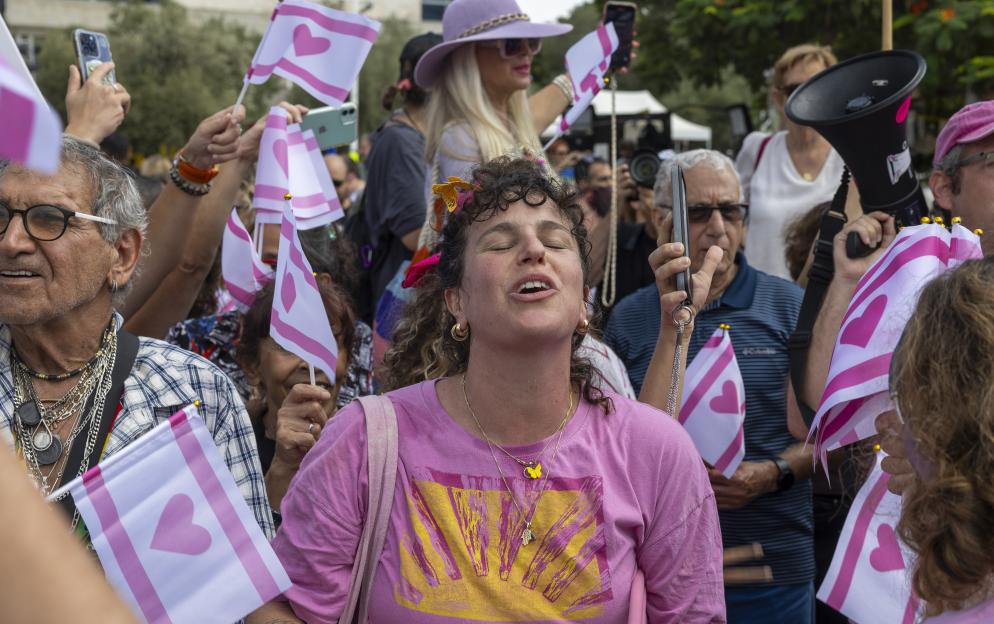 People celebrate in Tel Aviv at news that a peace deal has been signed and hostages are coming home.