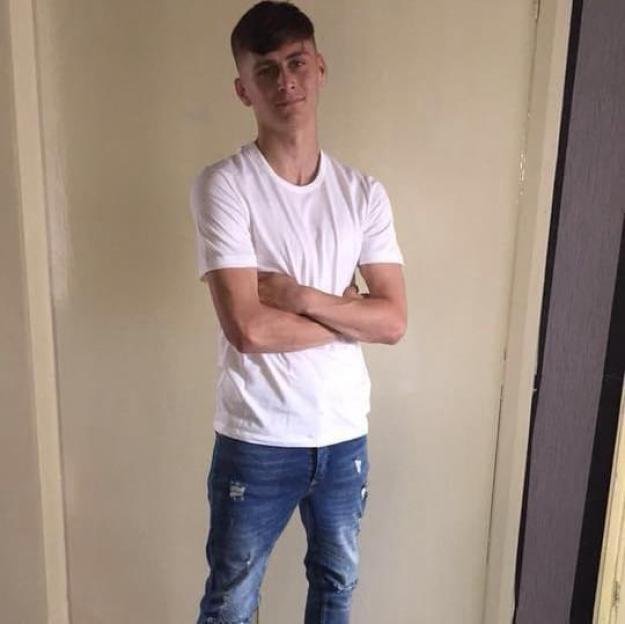Klayton Skelly posing with his arms crossed.