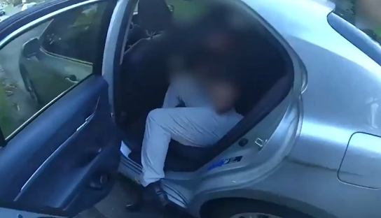 Person sitting in a car.