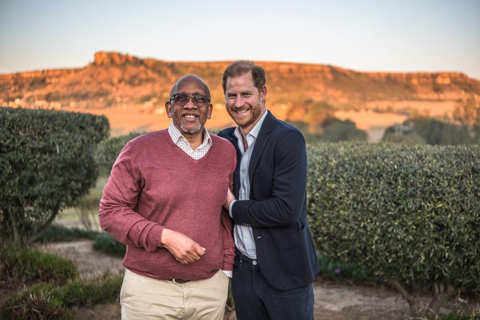 Prince Seeiso of Lesotho and Prince Harry smiling together outdoors.