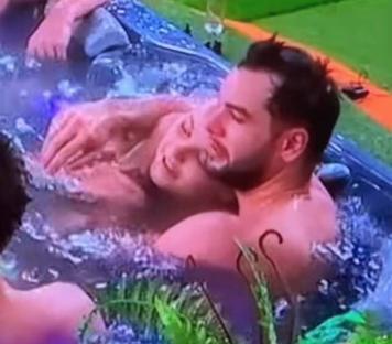 Jojo Siwa and Chris Hughes in a hot tub.