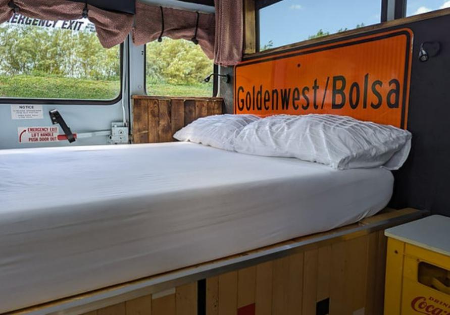 Bed in a converted school bus.