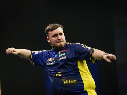 Luke Littler celebrating a darts win.