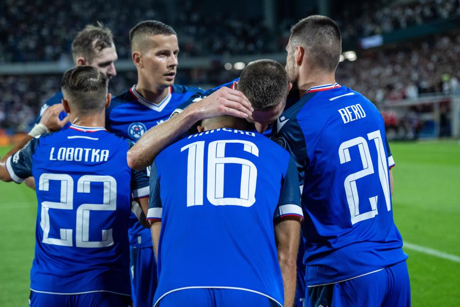 Slovakia soccer players celebrating a goal.