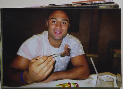 Photo of Luke Rhoden eating dessert.