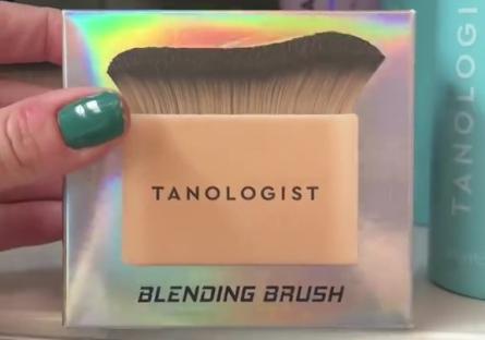 Tanologist blending brush in a supermarket.