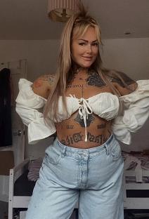 Woman with tattoos after breast reduction surgery.