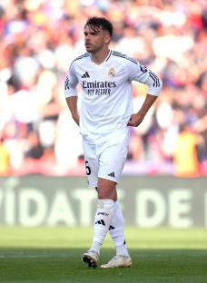 Raul Asencio of Real Madrid looking dejected after a game.