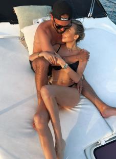 Olivia Attwood and Bradley Dack embracing on a boat.
