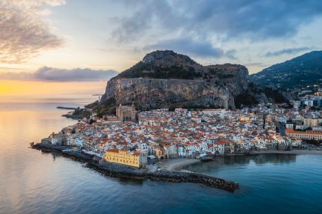 Aerial view of a coastal town at sunrise.