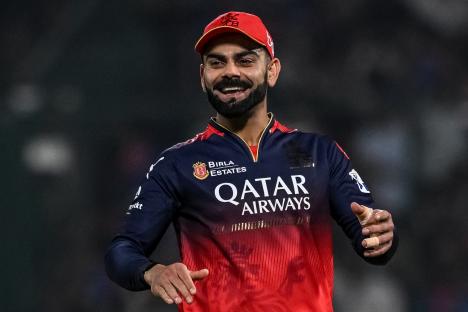 Virat Kohli gesturing during an IPL cricket match.