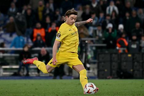 Patrick Berg kicking a soccer ball during a penalty shootout.