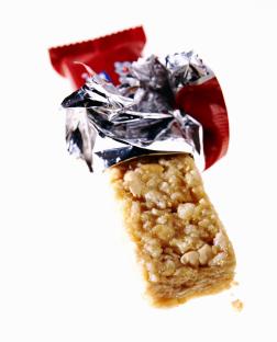 Partially unwrapped granola bar.