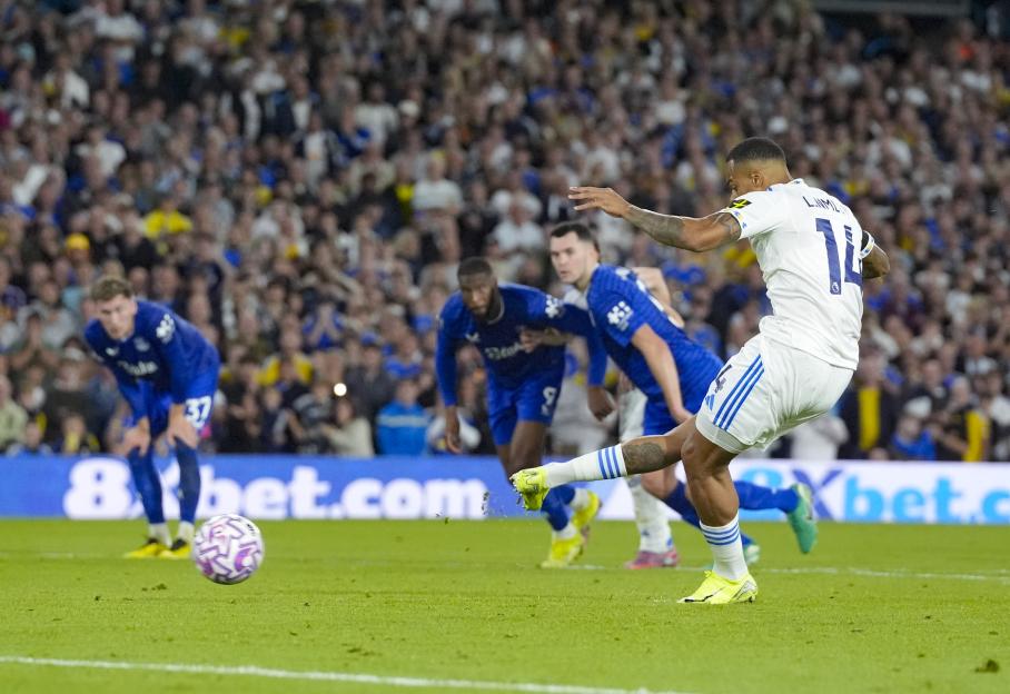 Lukas Nmecha taking a penalty kick.