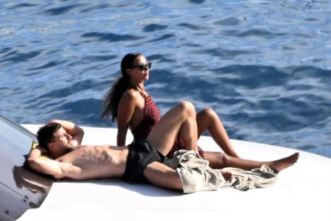 Maya Jama and Ruben Dias relaxing on a yacht.