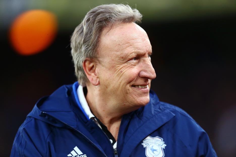Neil Warnock, manager of Cardiff City F.C., looking on.