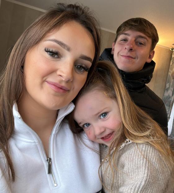 Millie Radford with her fiancé and daughter.
