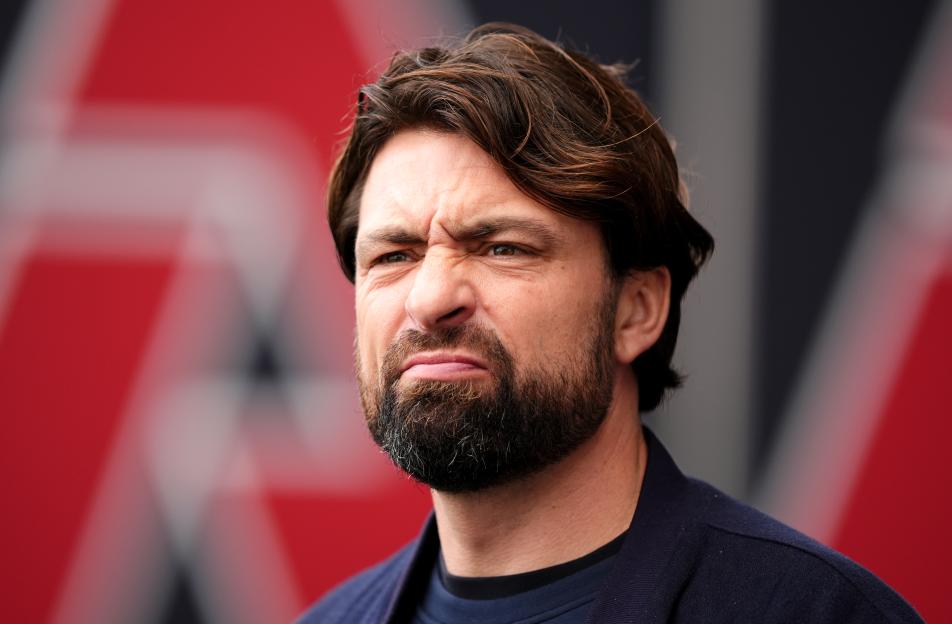 Rangers manager Russell Martin frowning at Falkirk Stadium.