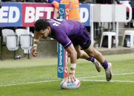 Jacob Gagai scoring a try in a rugby league match.