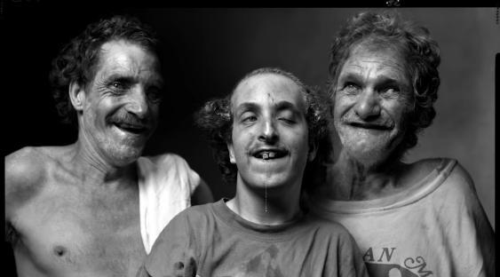 Black and white photo of three Whittaker family members.