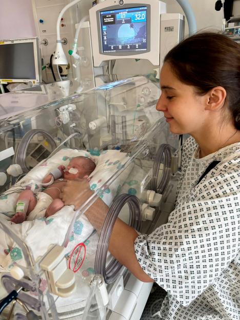 Megan Isherwood with baby Jackson in an incubator at the hospital.