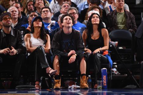Kendall Jenner, Timothée Chalamet, and Kylie Jenner at a basketball game.