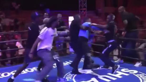 Shocking moment boxing referee is viciously attacked by several men in ring after fight before he is sent flying