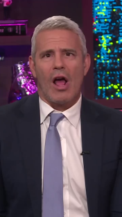 A man in a suit speaking.