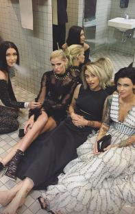 Bella Hadid, Lara Stone, Paris Jackson, and Ruby Rose in a restroom.