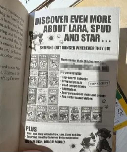 Sky Pups book showing a link to a porn site.
