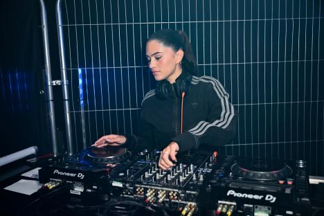 Woman DJing at an event.