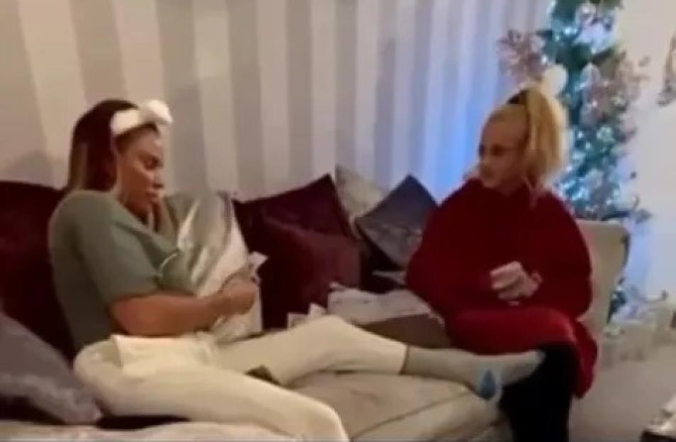 Screenshot of Katie Price and another woman sitting on a couch.