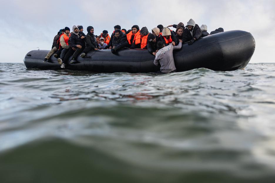 Migrants in a small boat attempting to cross the English Channel.